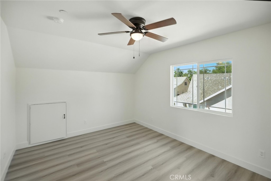 5151 Peony Court Riverside, CA 92506 - Photo 19 of 23 wooden floor in an empty room with a window