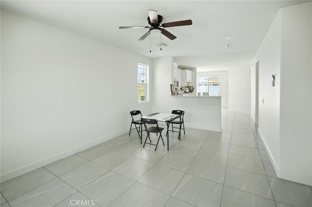 5151 Peony Court Riverside, CA 92506 - Photo 5 of 23 a view of a dining room with furniture and chandelier fan
