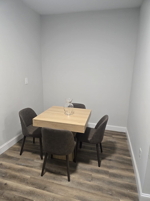 304 Warren Street, Unit 3L Boston, MA 02119 - Photo 4 of 9 a view of a workspace with furniture