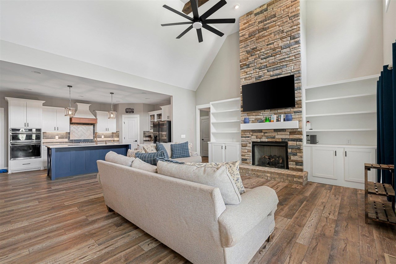 6400 Williams Road Cross Plains, TN 37049 - Photo 2 of 11 a living room with furniture a fireplace and a flat screen tv