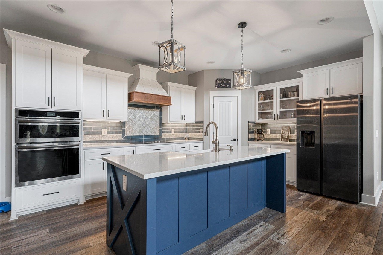 6400 Williams Road Cross Plains, TN 37049 - Photo 4 of 11 a kitchen with refrigerator cabinets and wooden floor