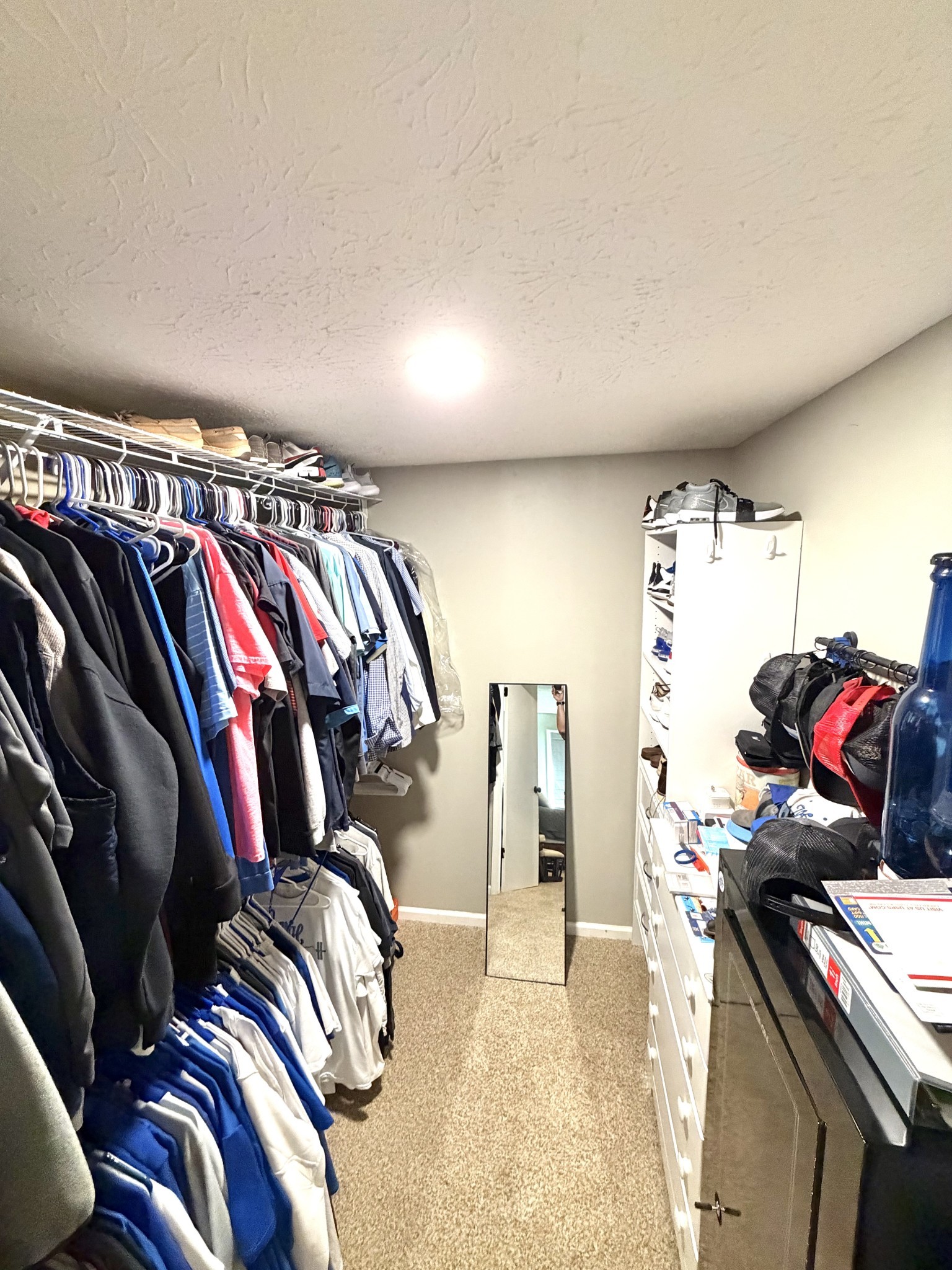 356 Lee Road Cottontown, TN 37048 - Photo 23 of 52 a view of walk in closet with clothes and shoes