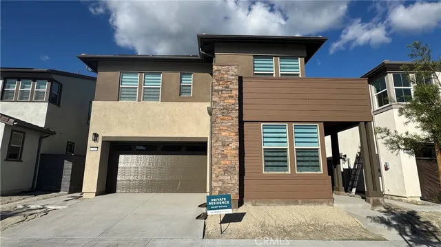 a front view of a house with a garage