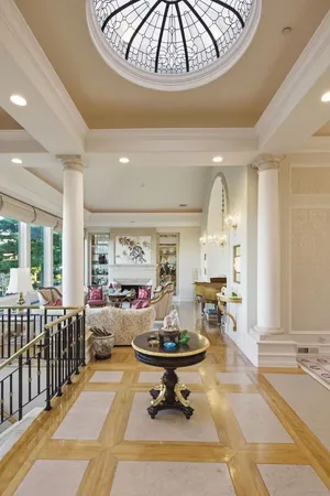 a bathroom with a granite countertop sink a large mirror and a bathtub