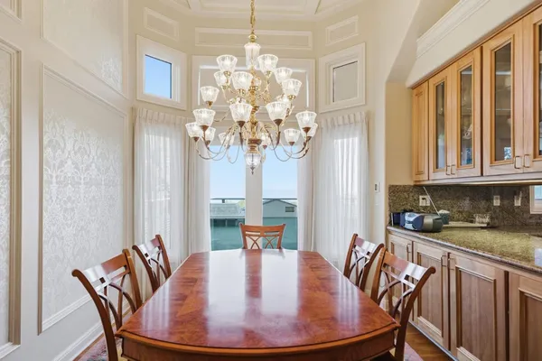 a view of a dining room with furniture window and outside view