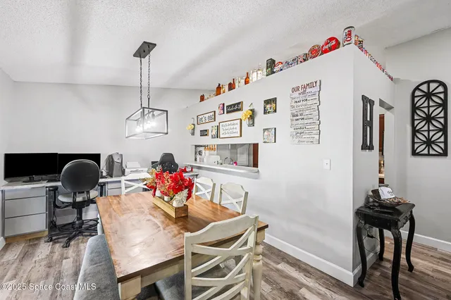 a workspace with furniture and a chandelier
