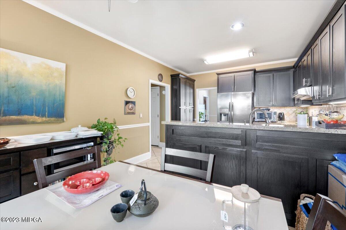 191 Rivoli Landing Macon, GA 31210 - Photo 12 of 45 a kitchen with kitchen island a sink stainless steel appliances and cabinets
