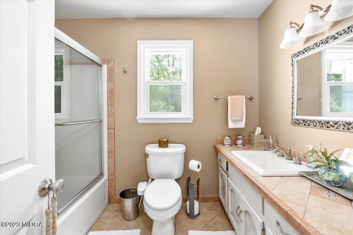 191 Rivoli Landing Macon, GA 31210 - Photo 14 of 45 a bathroom with a granite countertop toilet sink and mirror