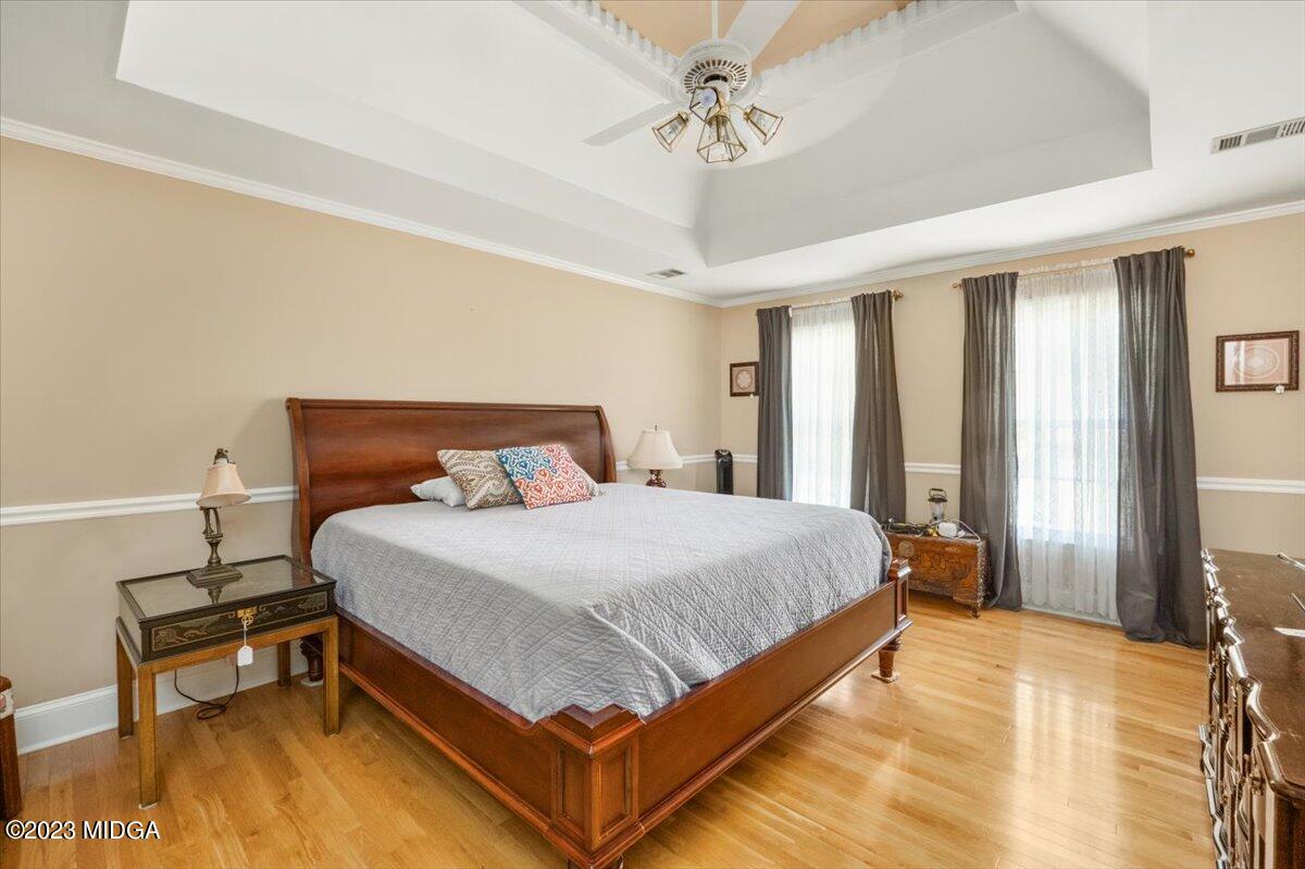 191 Rivoli Landing Macon, GA 31210 - Photo 17 of 45 a bedroom with a bed and a chandelier