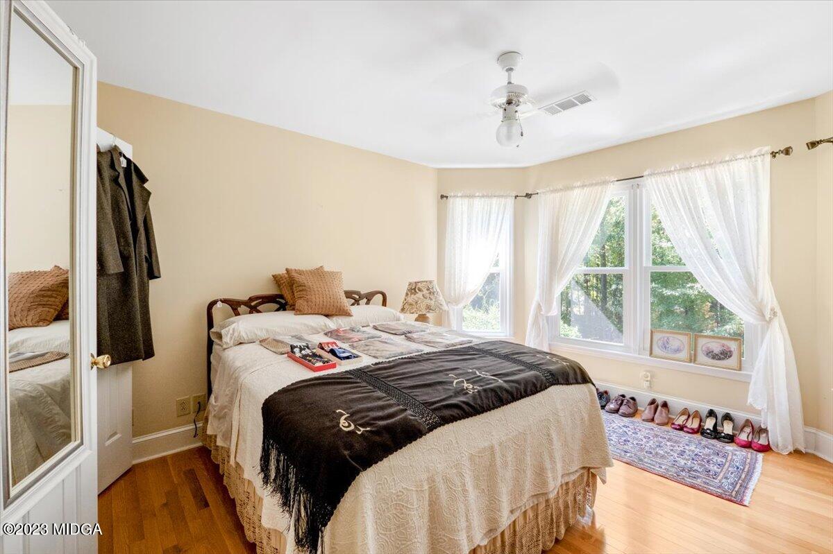 191 Rivoli Landing Macon, GA 31210 - Photo 19 of 45 a bedroom with a bed and a flat tv screen on the dresser