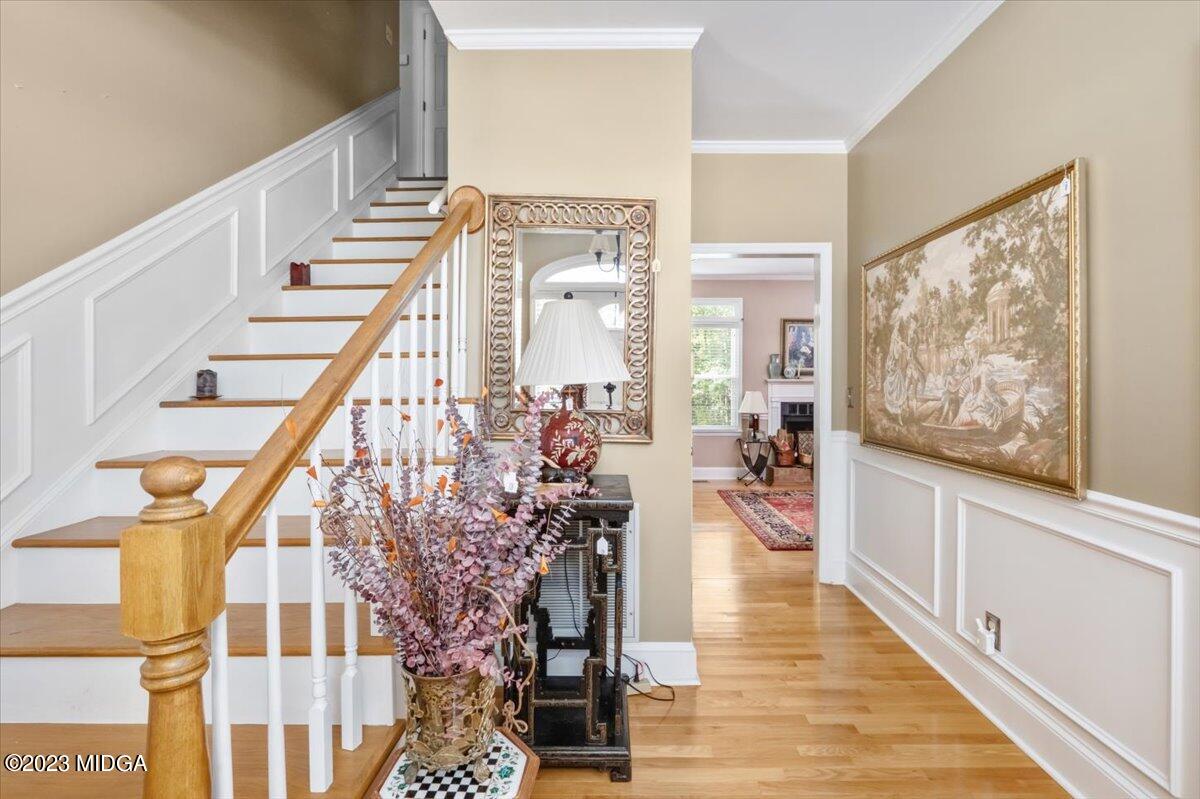191 Rivoli Landing Macon, GA 31210 - Photo 2 of 45 a view of a hallway with wooden floor and staircase