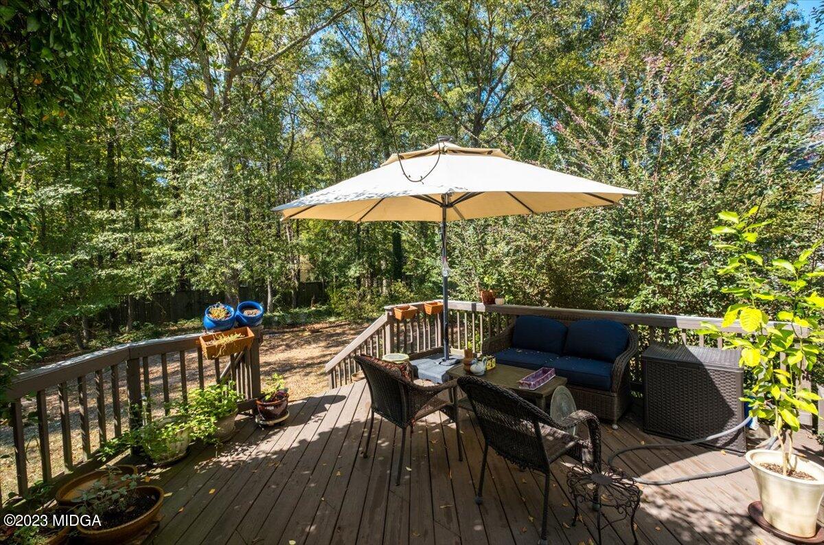 191 Rivoli Landing Macon, GA 31210 - Photo 25 of 45 a view of balcony with outdoor seating and wooden floor