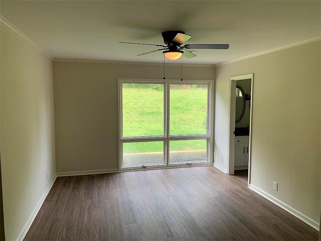 2435 Miller Ferry Road Southwest Calhoun, GA 30701 - Photo 13 of 21 a view of an empty room with a window and wooden floor