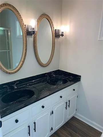 a bathroom with a sink and a mirror