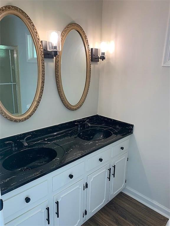 2435 Miller Ferry Road Southwest Calhoun, GA 30701 - Photo 14 of 21 a bathroom with a sink and a mirror