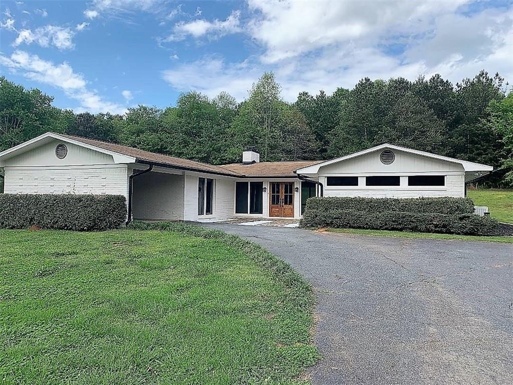 2435 Miller Ferry Road Southwest Calhoun, GA 30701 - Photo 2 of 21 a front view of a house with a yard