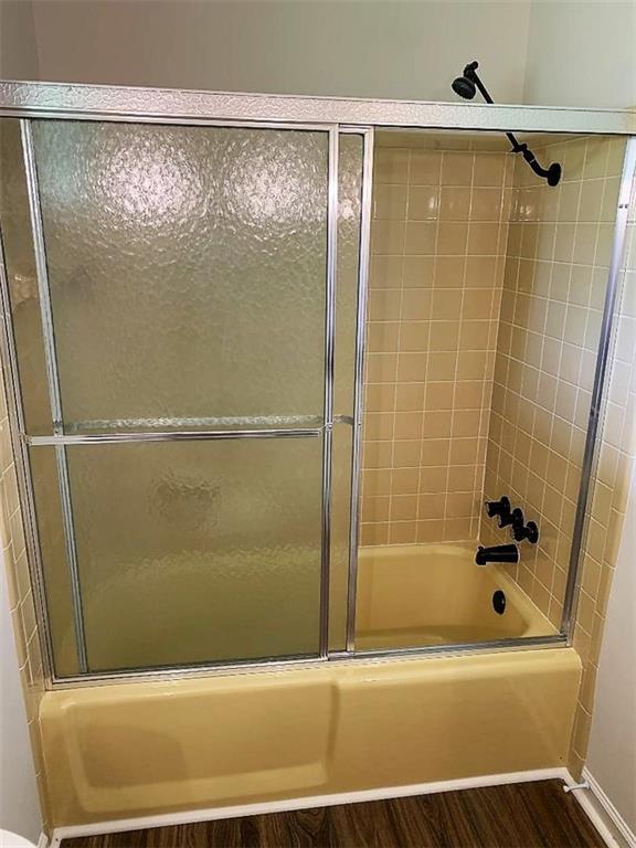 2435 Miller Ferry Road Southwest Calhoun, GA 30701 - Photo 21 of 21 a bathroom with a bathtub and a shower