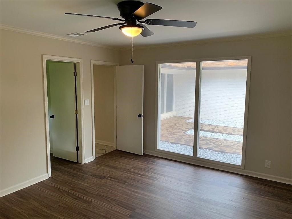 2435 Miller Ferry Road Southwest Calhoun, GA 30701 - Photo 10 of 21 a view of an empty room with wooden floor and a window