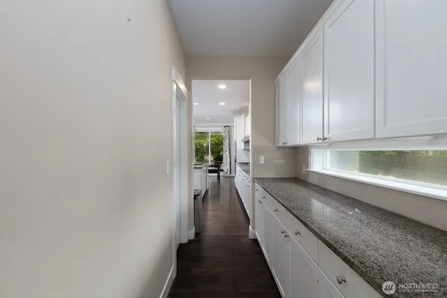 a view of a kitchen with a sink and dishwasher