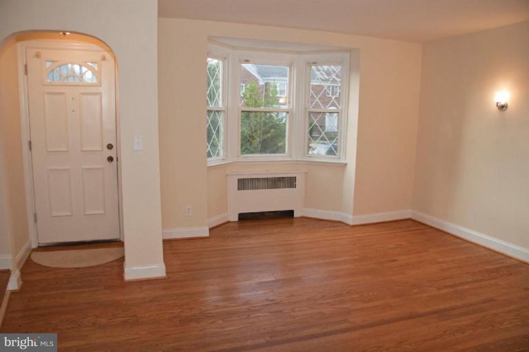 1538 Northgate Road Baltimore, MD 21218 - Photo 2 of 30 an empty room with wooden floor and windows