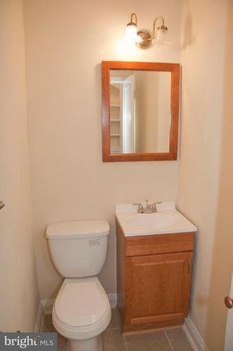 1538 Northgate Road Baltimore, MD 21218 - Photo 11 of 30 a bathroom with a toilet sink and mirror