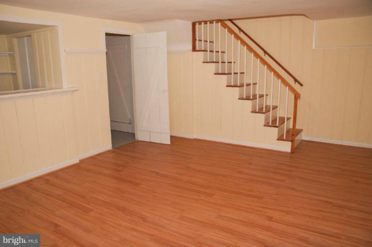 1538 Northgate Road Baltimore, MD 21218 - Photo 12 of 30 a view of staircase with wooden floor