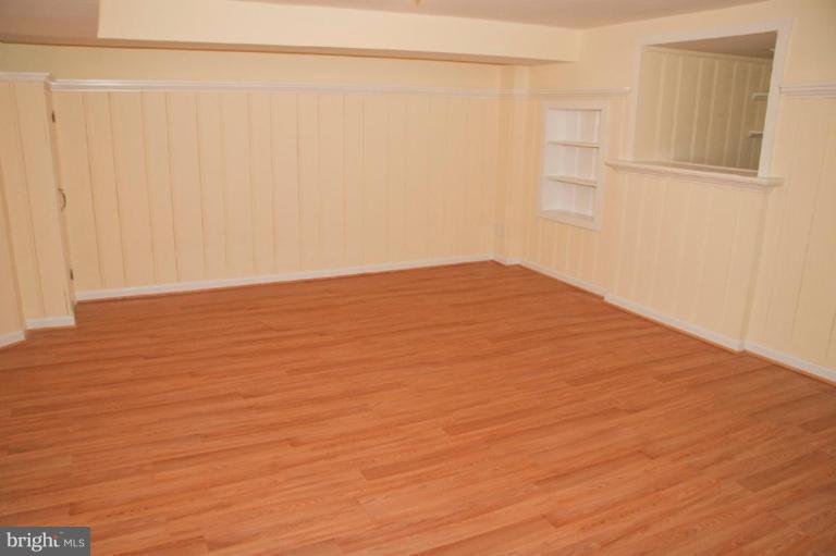 1538 Northgate Road Baltimore, MD 21218 - Photo 14 of 30 a view of empty room with wooden floor