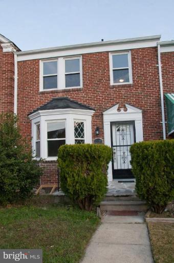 1538 Northgate Road Baltimore, MD 21218 - Photo 29 of 30 a front view of a house with a garden