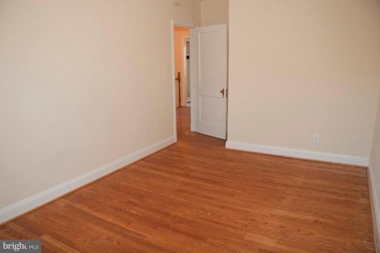 1538 Northgate Road Baltimore, MD 21218 - Photo 30 of 30 a view of an empty room with wooden floor