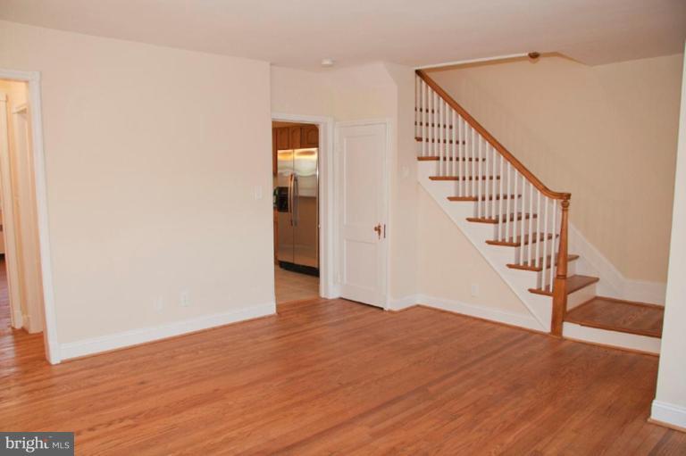 1538 Northgate Road Baltimore, MD 21218 - Photo 4 of 30 a view of a hallway with wooden floor and staircase