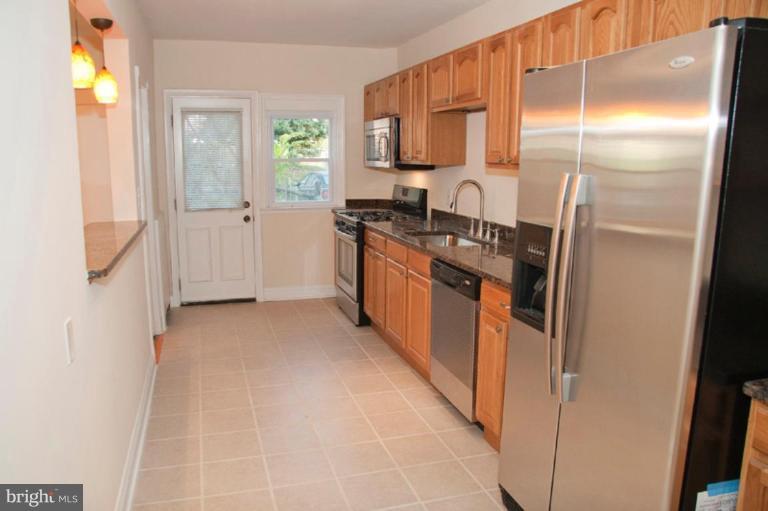 1538 Northgate Road Baltimore, MD 21218 - Photo 8 of 30 a kitchen with stainless steel appliances granite countertop a refrigerator and a stove