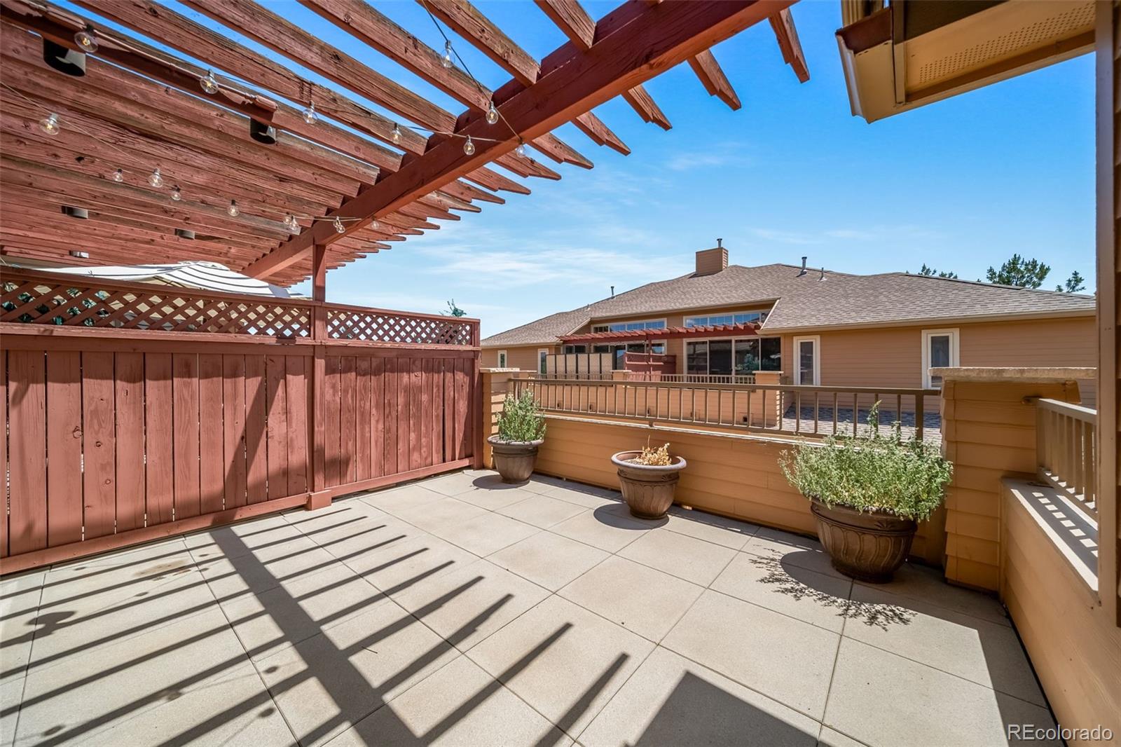 8626 Gold Peak Drive, Unit B Highlands Ranch, CO 80130 - Photo 16 of 40 a front view of a house with garden