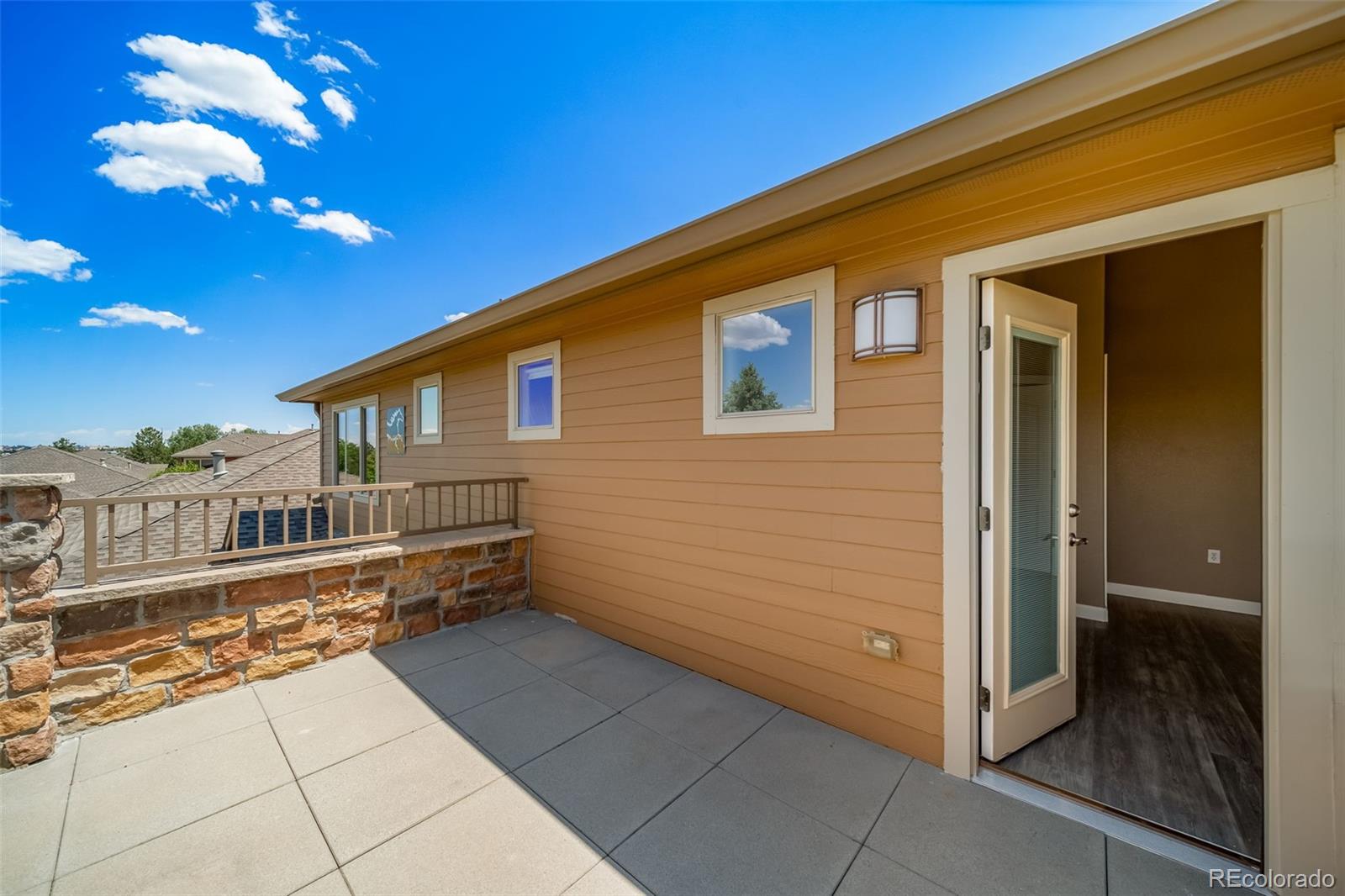 8626 Gold Peak Drive, Unit B Highlands Ranch, CO 80130 - Photo 22 of 40 a view of a house with a balcony