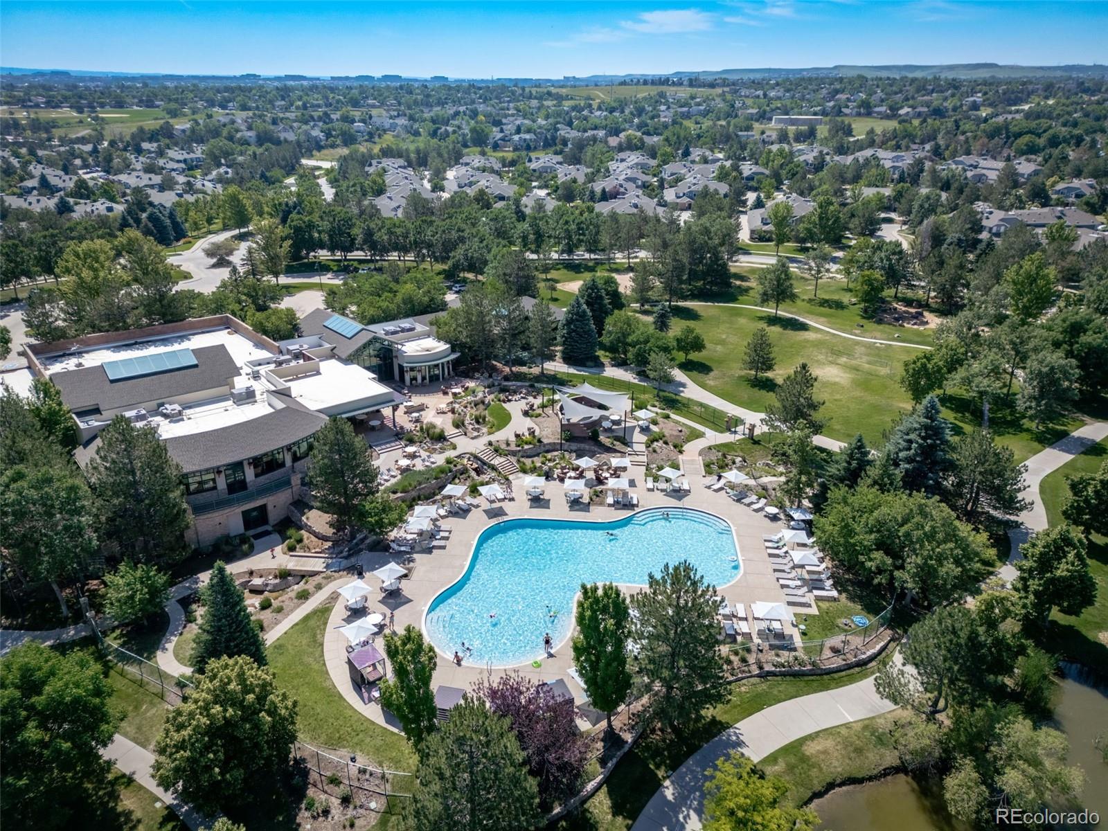 8626 Gold Peak Drive, Unit B Highlands Ranch, CO 80130 - Photo 26 of 40 an aerial view of residential houses with outdoor space and river