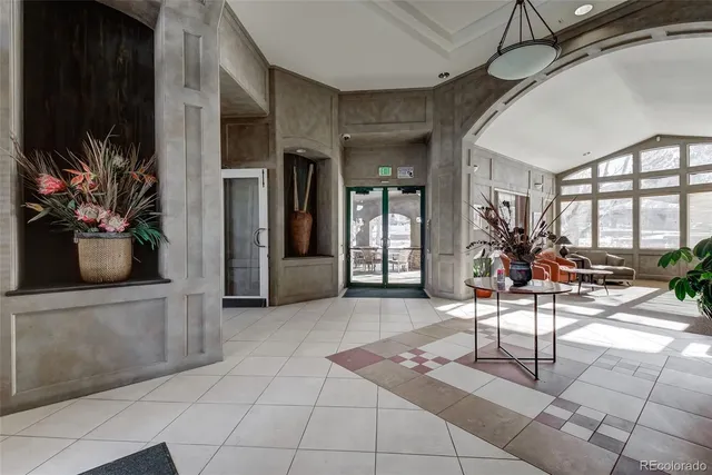 a view of a entryway with furniture and floor to ceiling window