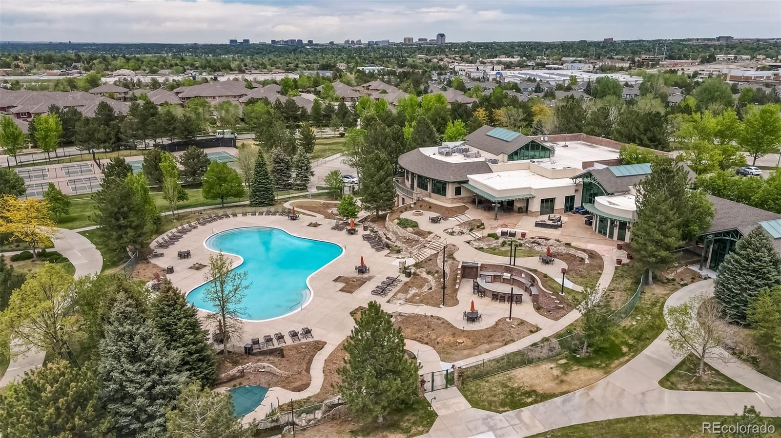 8626 Gold Peak Drive, Unit B Highlands Ranch, CO 80130 - Photo 32 of 40 an aerial view of a house with outdoor space and lake view