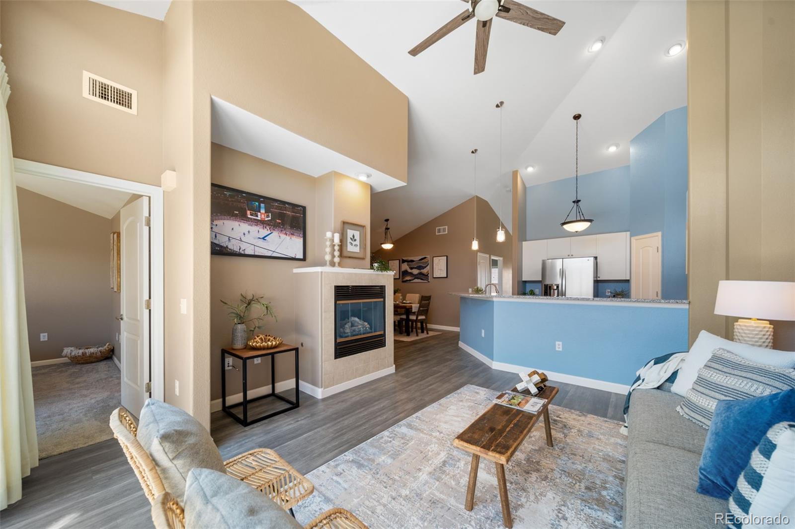 8626 Gold Peak Drive, Unit B Highlands Ranch, CO 80130 - Photo 8 of 40 a living room with furniture and a wooden floor