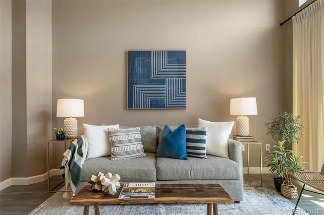 a living room with furniture and a lamp