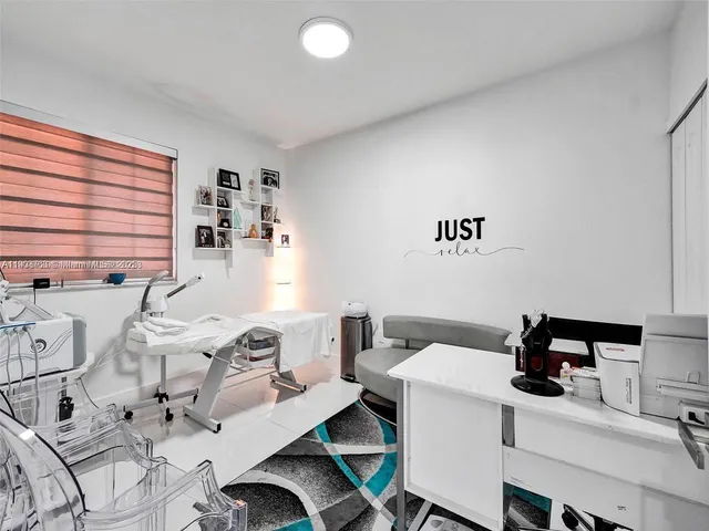 a workspace with furniture and window