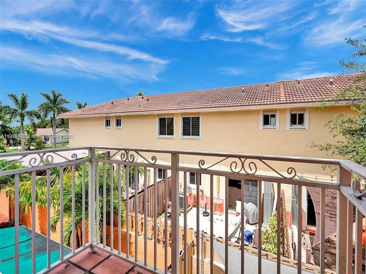 7565 Northwest 177th Terrace, Unit 7565 Hialeah, FL 33015 - Photo 31 of 35 a view of a house with wooden fence