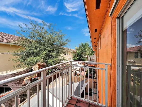 a view of balcony with furniture