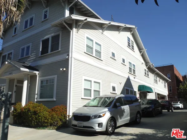 a front view of a house with sitting area