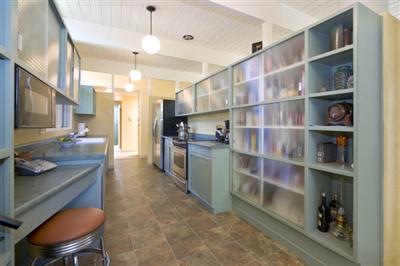 750 Del Ganado Road San Rafael, CA 94903 - Photo 3 of 13 a kitchen with stainless steel appliances granite countertop a table chairs and a refrigerator