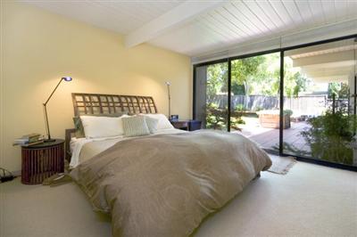 750 Del Ganado Road San Rafael, CA 94903 - Photo 7 of 13 a large bed sitting in a bedroom next to a large window