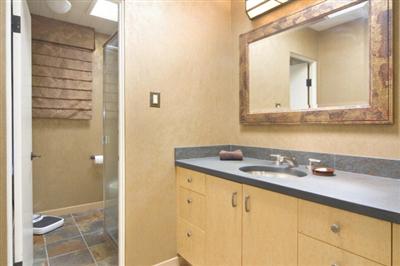 750 Del Ganado Road San Rafael, CA 94903 - Photo 8 of 13 a bathroom with a granite countertop sink and a mirror