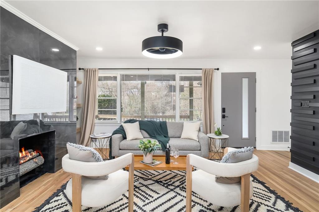 108 Burbank Drive Southwest Atlanta, GA 30314 - Photo 13 of 53 a living room with furniture and a floor to ceiling window