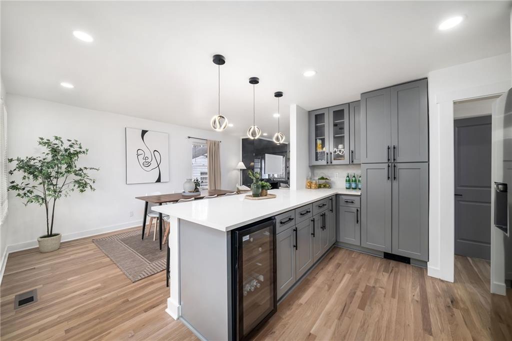 108 Burbank Drive Southwest Atlanta, GA 30314 - Photo 19 of 53 a kitchen with a sink and wooden floor