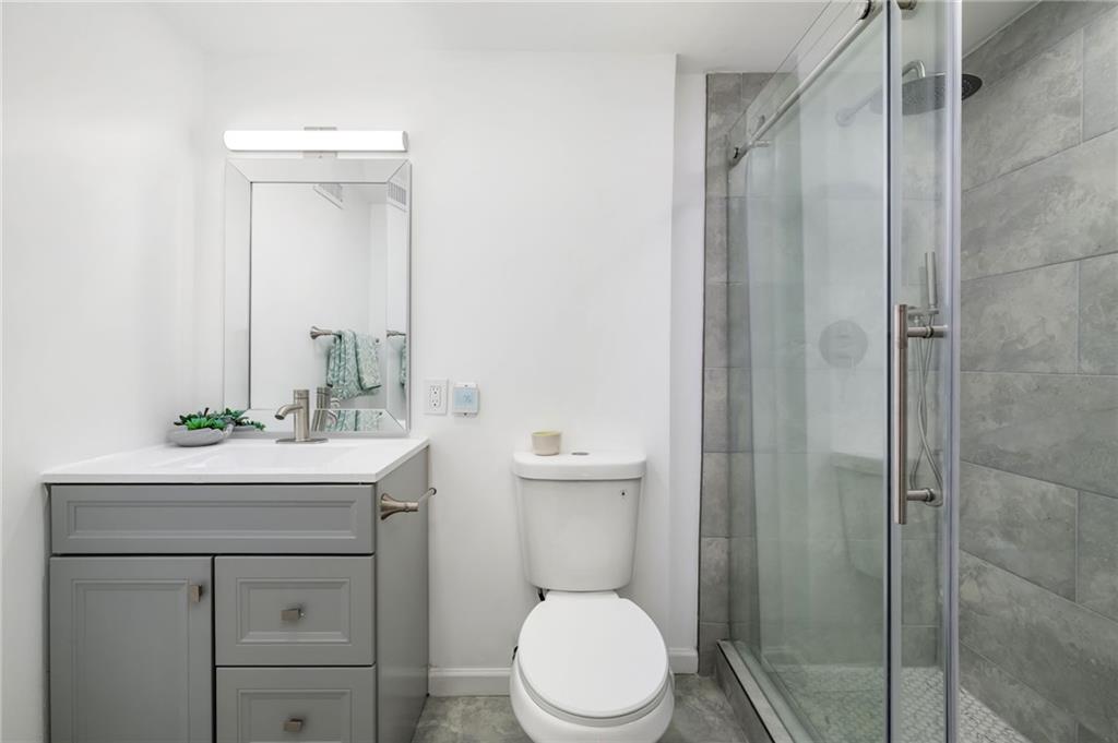 108 Burbank Drive Southwest Atlanta, GA 30314 - Photo 29 of 53 a bathroom with a sink a toilet and shower