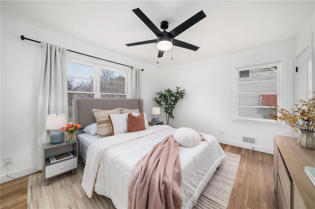 108 Burbank Drive Southwest Atlanta, GA 30314 - Photo 32 of 53 a bed room with a bed and a potted plant