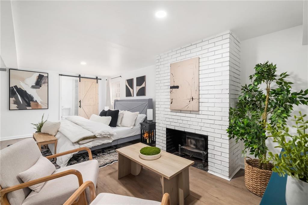 108 Burbank Drive Southwest Atlanta, GA 30314 - Photo 4 of 53 a living room with furniture and a fireplace
